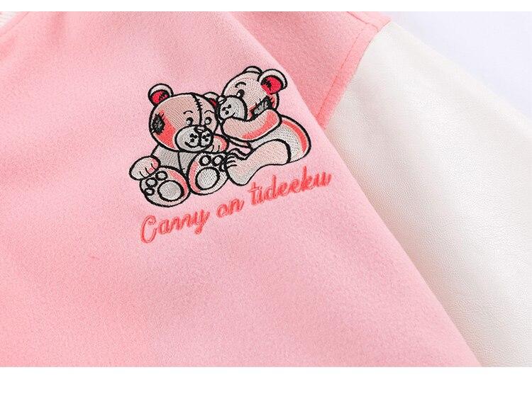 Men's varsity jacket featuring bear embroidery and patchwork design, perfect for autumn and winter wear.