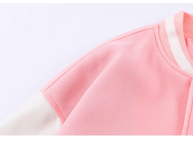 Men's varsity jacket featuring bear embroidery and patchwork design, perfect for autumn and winter wear.