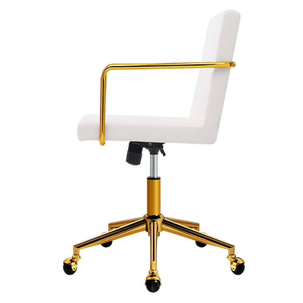 Caraway Velvet Office Chair with metallic brass base and armrests, featuring luxurious white upholstery and smooth ball-shaped castors.
