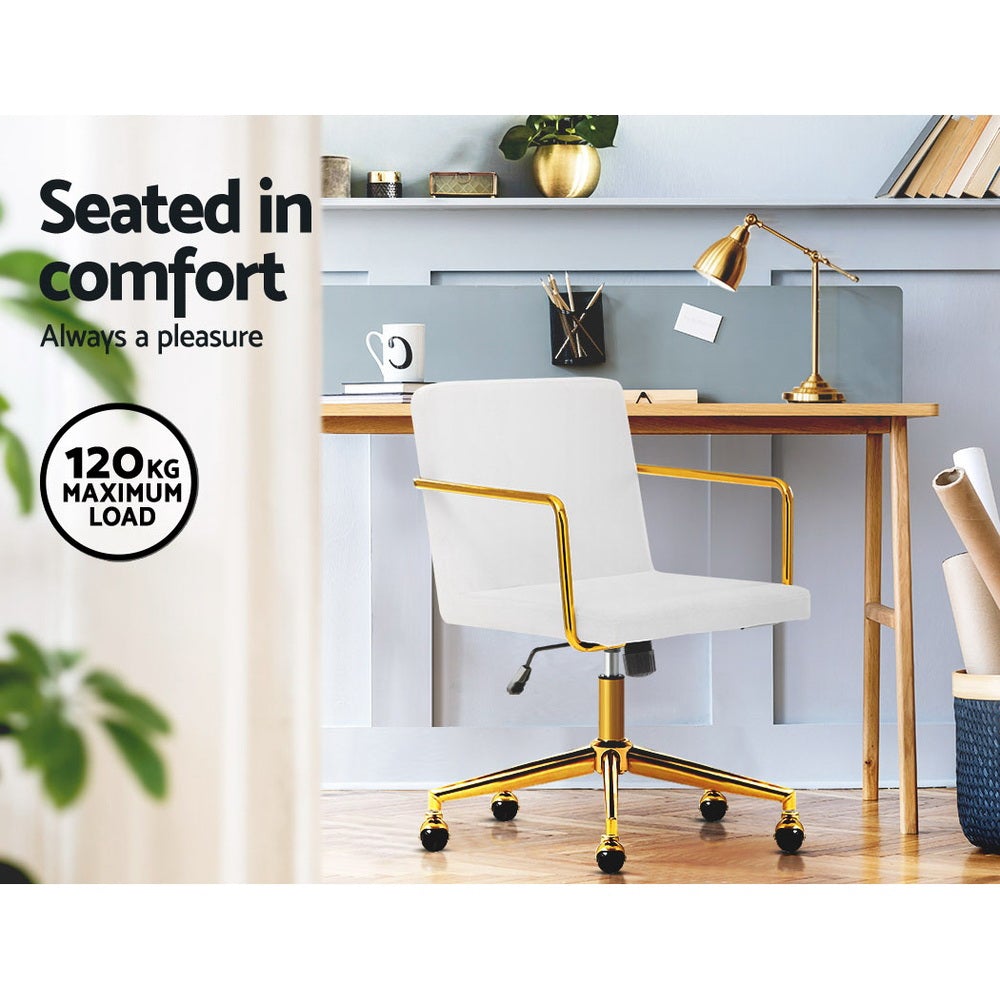 Caraway Velvet Office Chair with metallic brass base and armrests, featuring luxurious white upholstery and smooth ball-shaped castors.