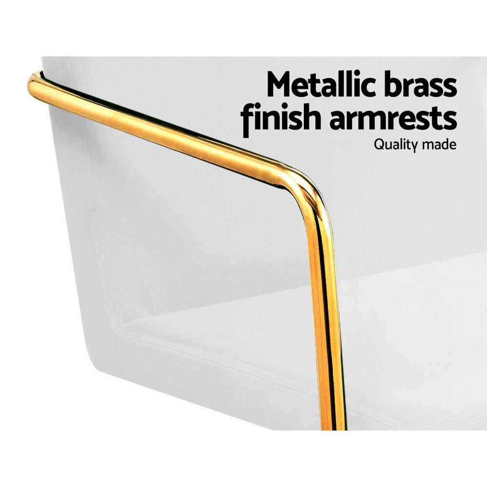 Caraway Velvet Office Chair with metallic brass base and armrests, featuring luxurious white upholstery and smooth ball-shaped castors.