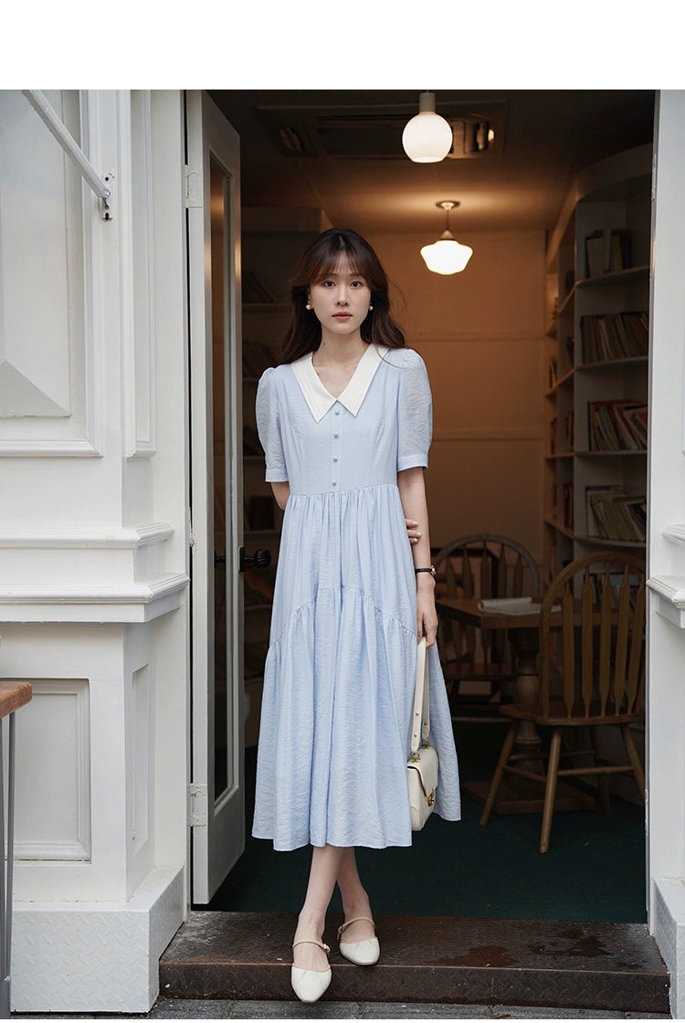 A stylish Vertical Texture Lightweight Short Sleeve Dress displayed on a mannequin, showcasing its unique texture and short sleeves.
