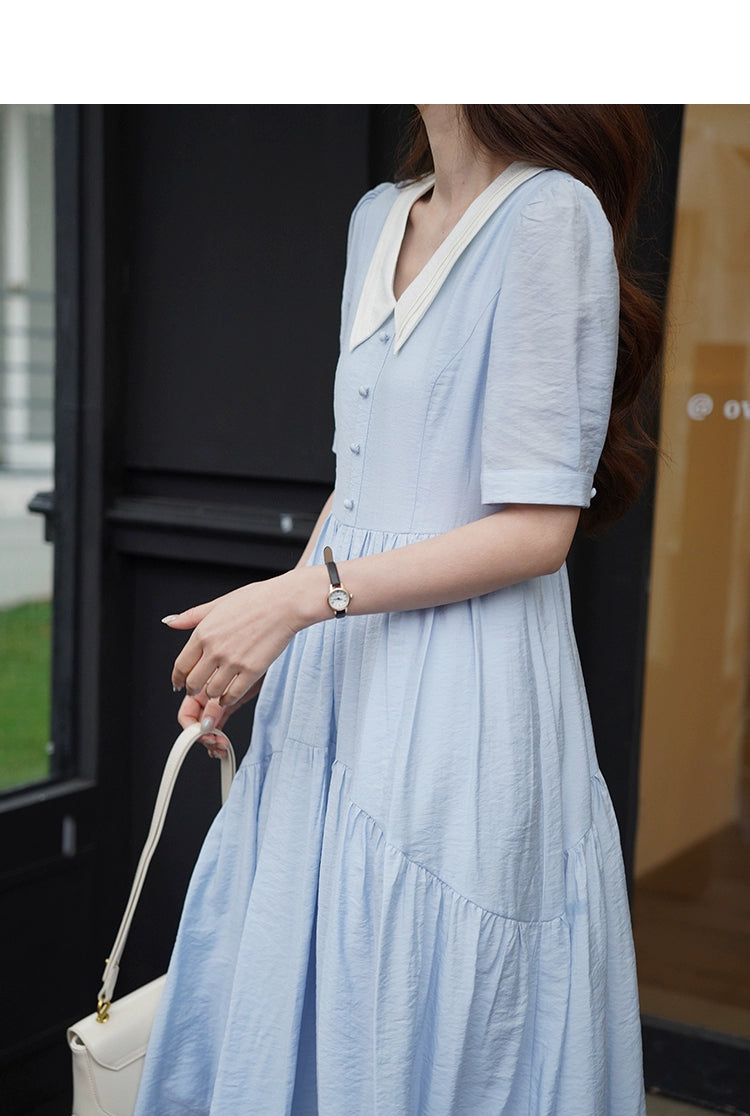 A stylish Vertical Texture Lightweight Short Sleeve Dress displayed on a mannequin, showcasing its unique texture and short sleeves.