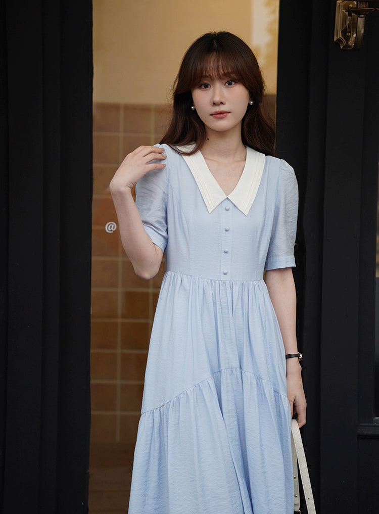A stylish Vertical Texture Lightweight Short Sleeve Dress displayed on a mannequin, showcasing its unique texture and short sleeves.