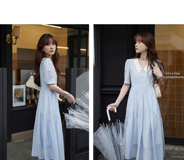 A stylish Vertical Texture Lightweight Short Sleeve Dress displayed on a mannequin, showcasing its unique texture and short sleeves.