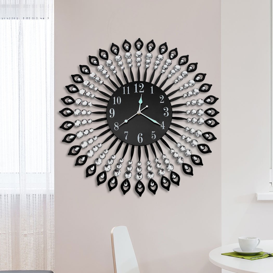 A luxurious large round wall clock with a sleek metal frame and sparkling transparent crystals, designed for modern home and office decor.