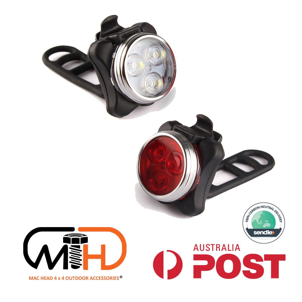 A set of waterproof bicycle lights featuring a white front light and a red rear light, designed for safety and visibility during cycling.