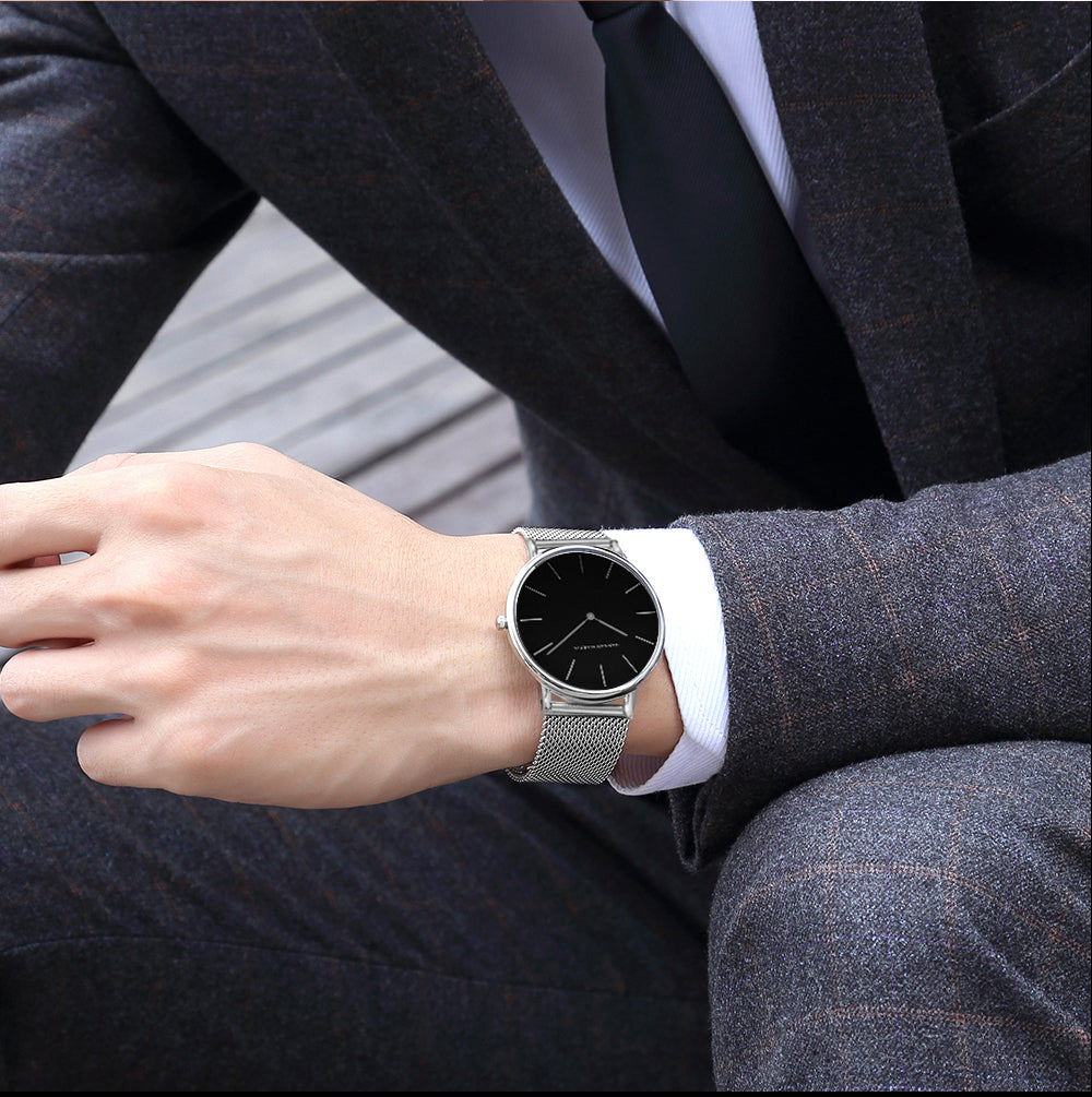 A stylish black watch featuring a waterproof Japan quartz movement and a stainless steel mesh band, perfect for men.