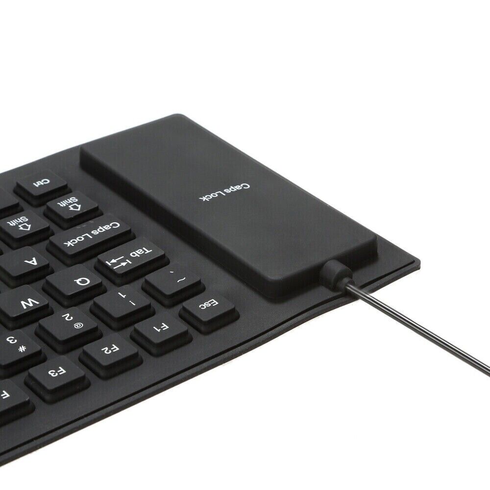 A flexible and foldable waterproof silicone keyboard in black, showcasing its USB connection and dustproof features.