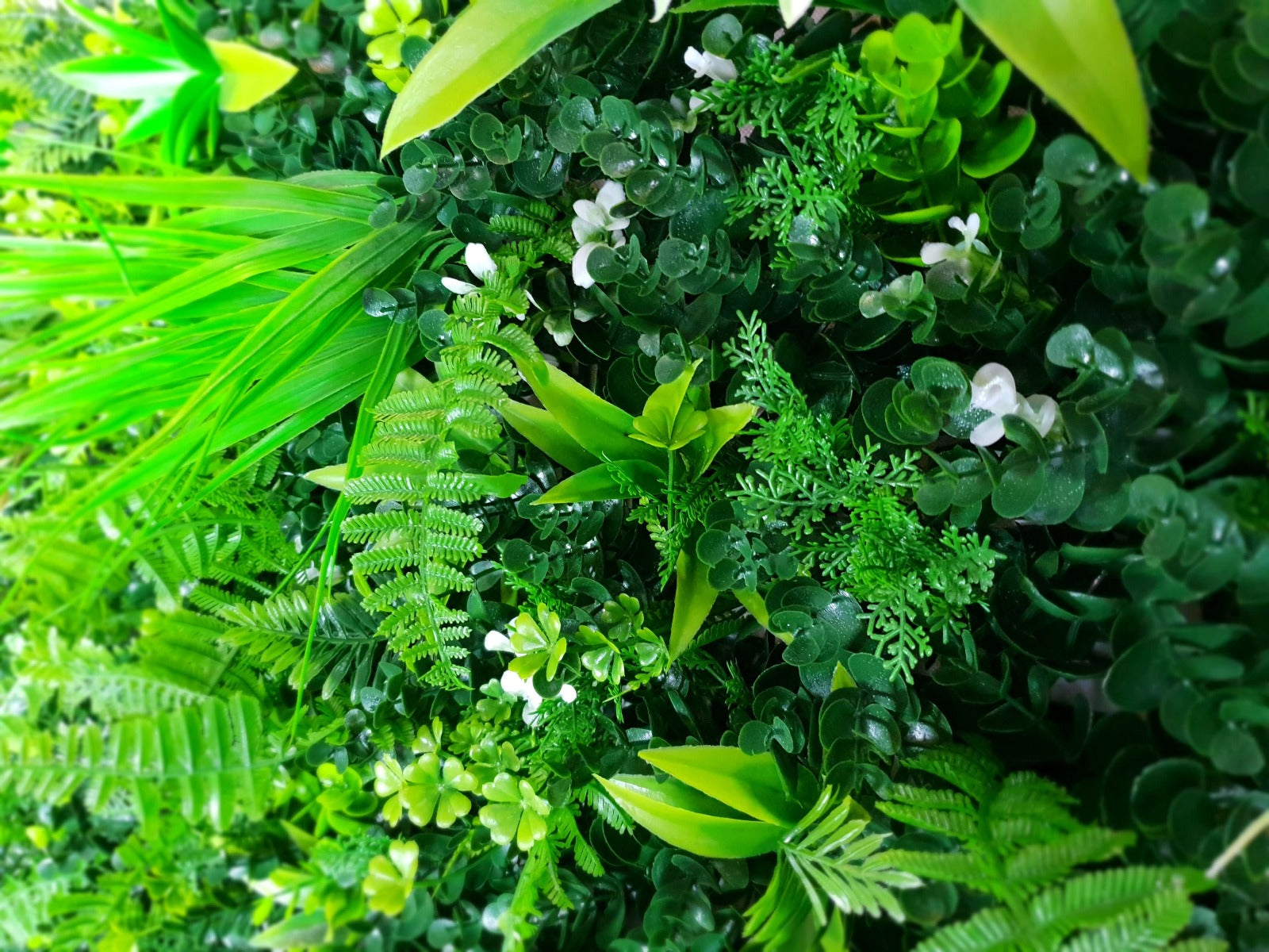 WILD TROPICS UV STABILISED 1m x 1m vertical garden panel featuring lush, exotic artificial foliage suitable for indoor and outdoor use.