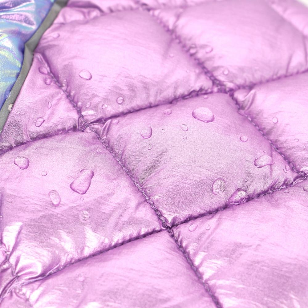 A warm and stylish winter dog jumpsuit in white and pink, featuring a fur collar, designed for small to medium dogs like Chihuahuas and Pugs.