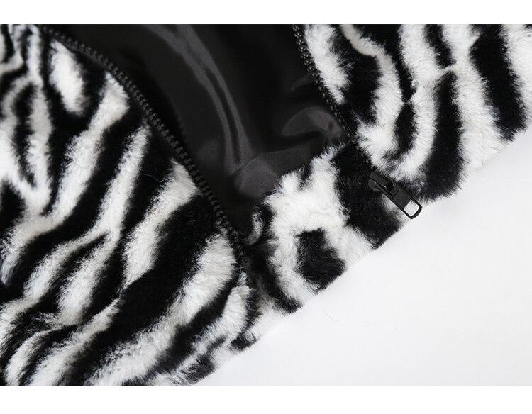 Men's winter jacket featuring heart embroidery and zebra striped print, designed for warmth and style.