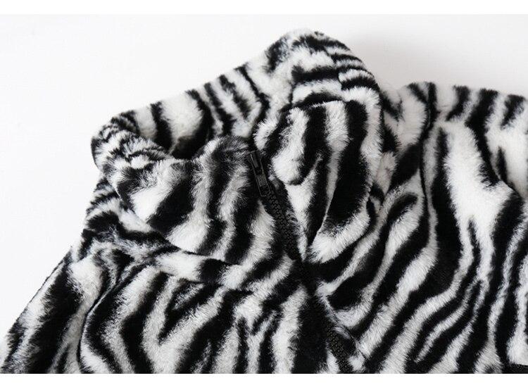 Men's winter jacket featuring heart embroidery and zebra striped print, designed for warmth and style.