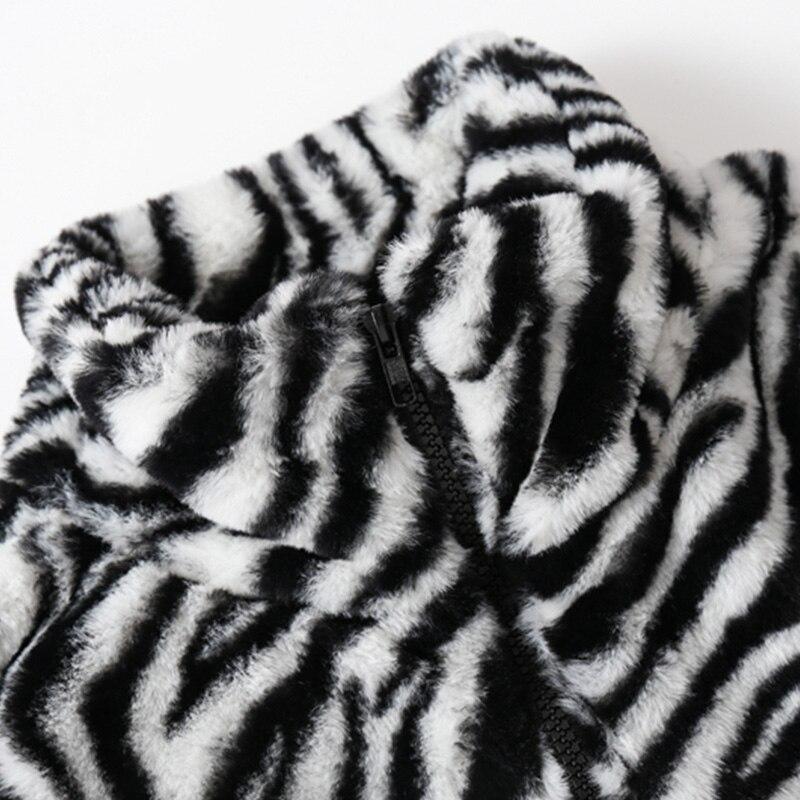 Men's winter jacket featuring heart embroidery and zebra striped print, designed for warmth and style.