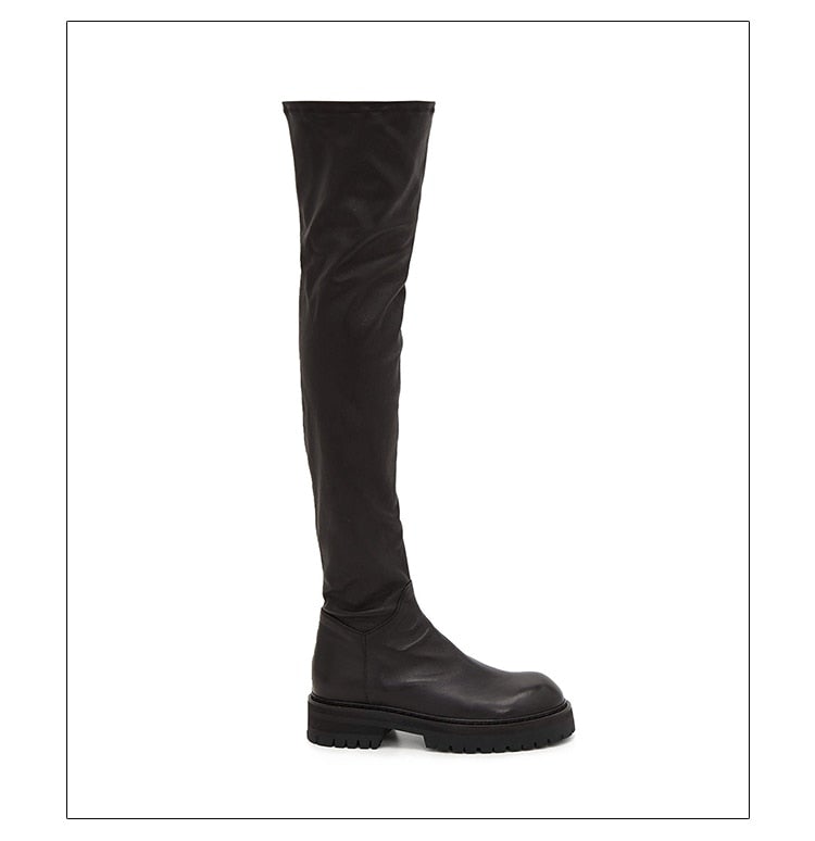A pair of stylish black over-the-knee boots made from genuine leather, featuring a zipper closure and elastic design for a comfortable fit.