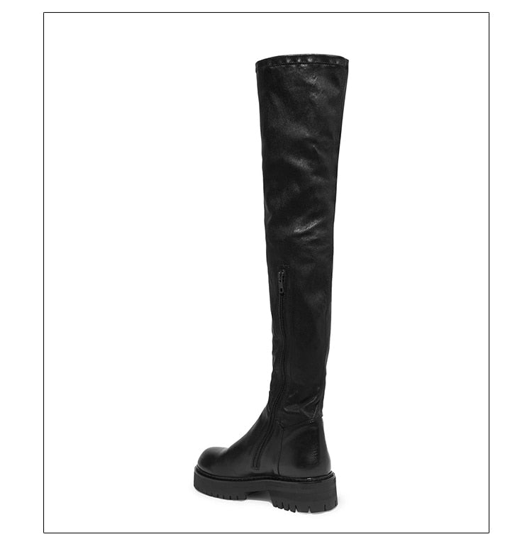 A pair of stylish black over-the-knee boots made from genuine leather, featuring a zipper closure and elastic design for a comfortable fit.