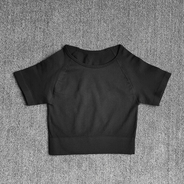 Women wearing a stylish short sleeve crop top yoga shirt in various colors, perfect for fitness and running.