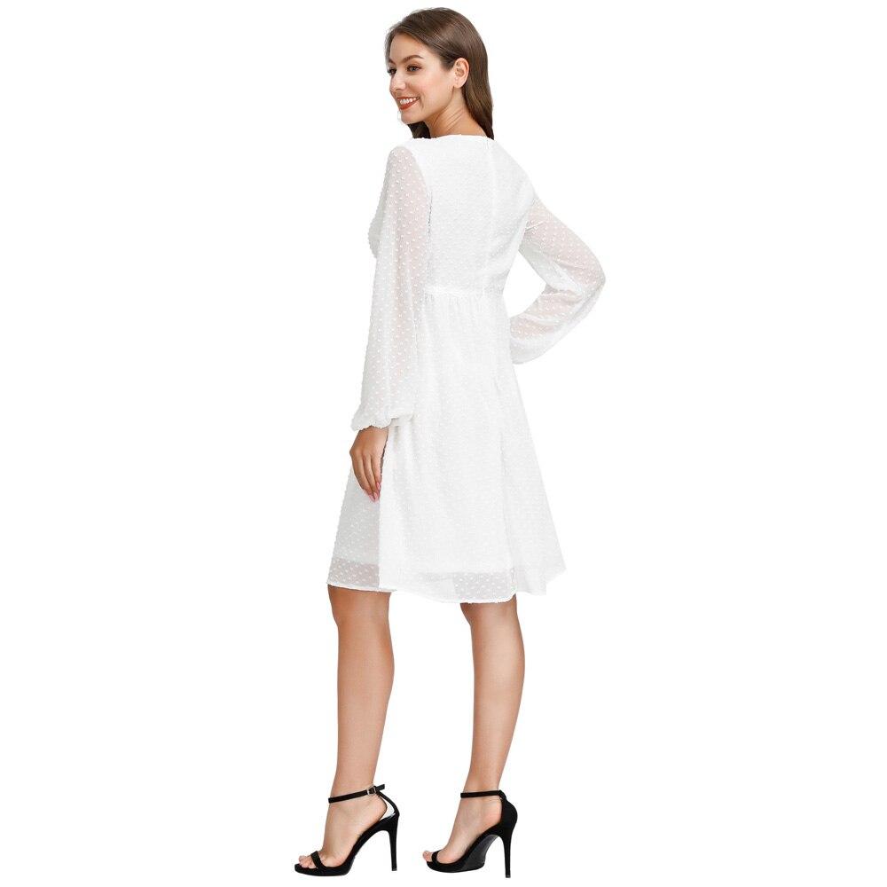 A stylish Women's V-Neck Empire Waist Swing Dress featuring full lantern sleeves and a flared A-line silhouette, perfect for summer occasions.