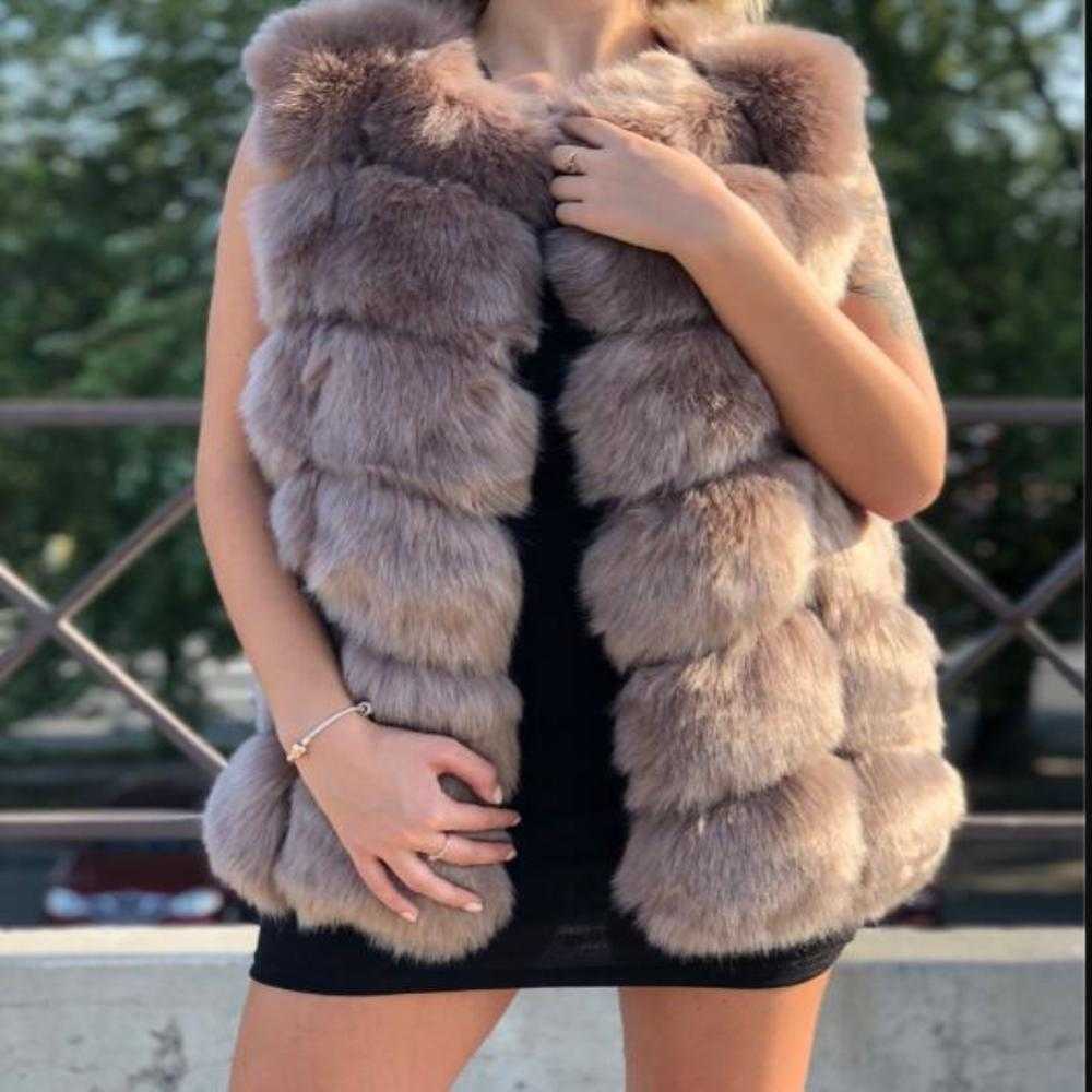 Women's faux fur vest coat in silver, featuring a warm V-neck design and luxurious faux fur material, perfect for winter fashion.