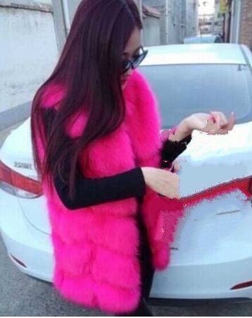 Women's faux fur vest coat in silver, featuring a warm V-neck design and luxurious faux fur material, perfect for winter fashion.