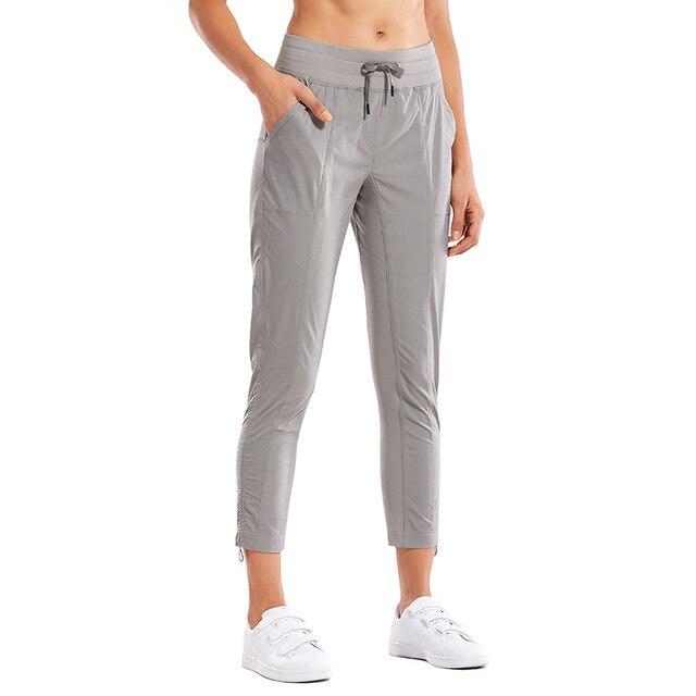 Women's Go to Studio Jogger Striped Cargo Pants featuring a drawstring leg and 7/8 length, perfect for workouts and casual wear.