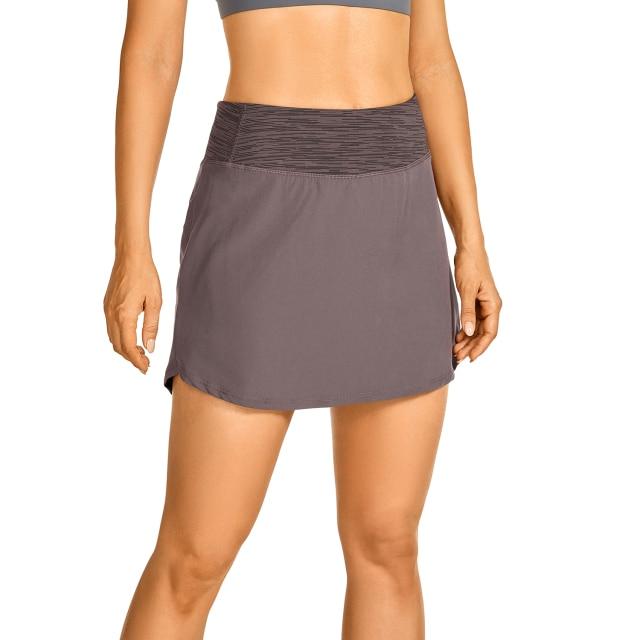 Women's lightweight athletic skorts in solid color with zipper pocket, perfect for tennis and golf.