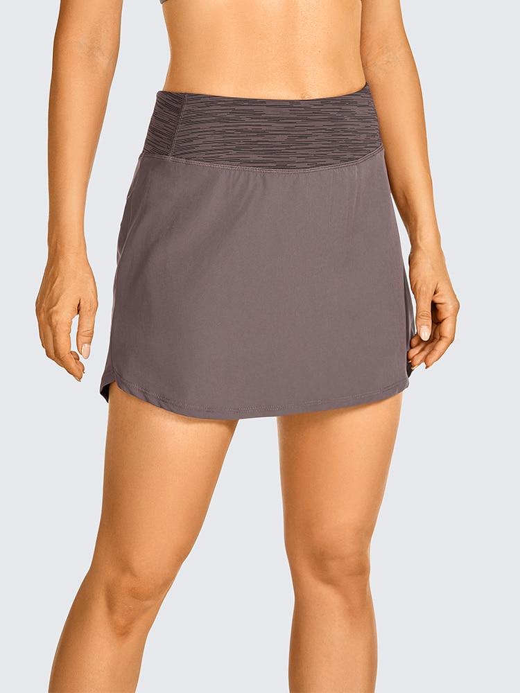 Women's lightweight athletic skorts in solid color with zipper pocket, perfect for tennis and golf.