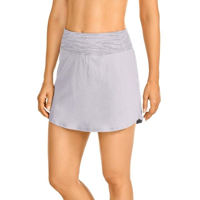 Women's lightweight athletic skorts in solid color with zipper pocket, perfect for tennis and golf.