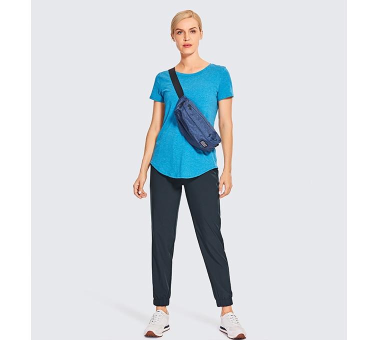 A pair of women's lightweight joggers pants in black with pockets and a drawstring elastic waist, perfect for athletic and casual wear.