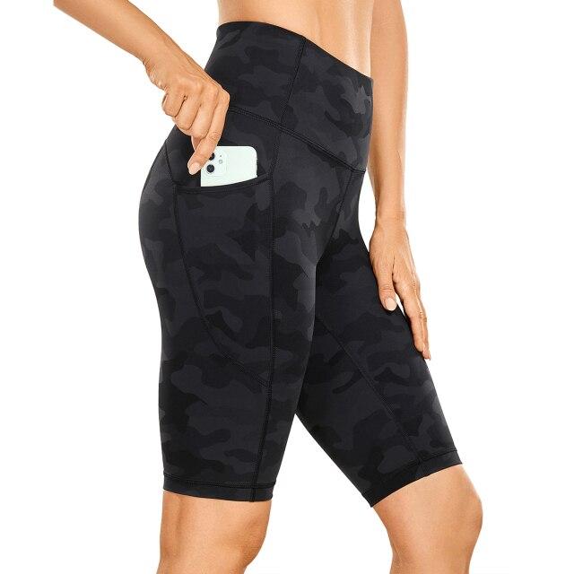 Women's Naked Feeling Workout Shorts in black, featuring a high waist and 10-inch inseam, designed for yoga and athletic activities with pockets.