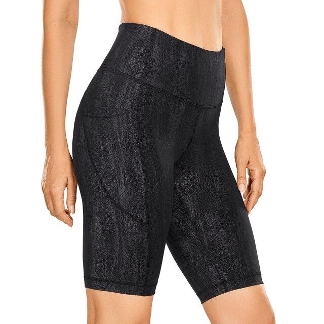 Women's Naked Feeling Workout Shorts in black, featuring a high waist and 10-inch inseam, designed for yoga and athletic activities with pockets.