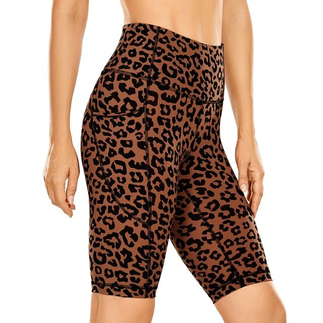 Women's Naked Feeling Workout Shorts in black, featuring a high waist and 10-inch inseam, designed for yoga and athletic activities with pockets.