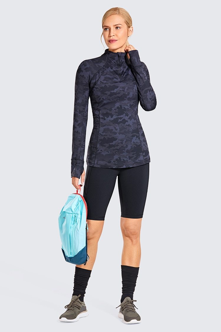 Women's Naked Feeling Workout Shorts in black, featuring a high waist and 10-inch inseam, designed for yoga and athletic activities with pockets.