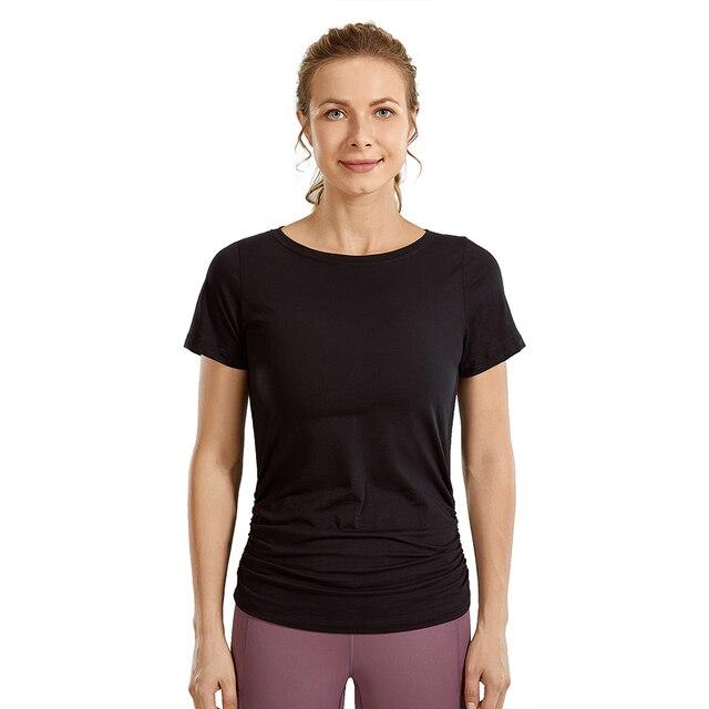 A stylish Women's Pima Cotton Short Sleeve Workout Shirt in a slim-fit design, featuring side shirring, perfect for yoga and workouts.