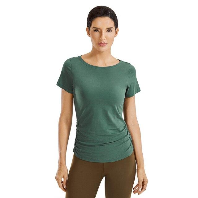 A stylish Women's Pima Cotton Short Sleeve Workout Shirt in a slim-fit design, featuring side shirring, perfect for yoga and workouts.