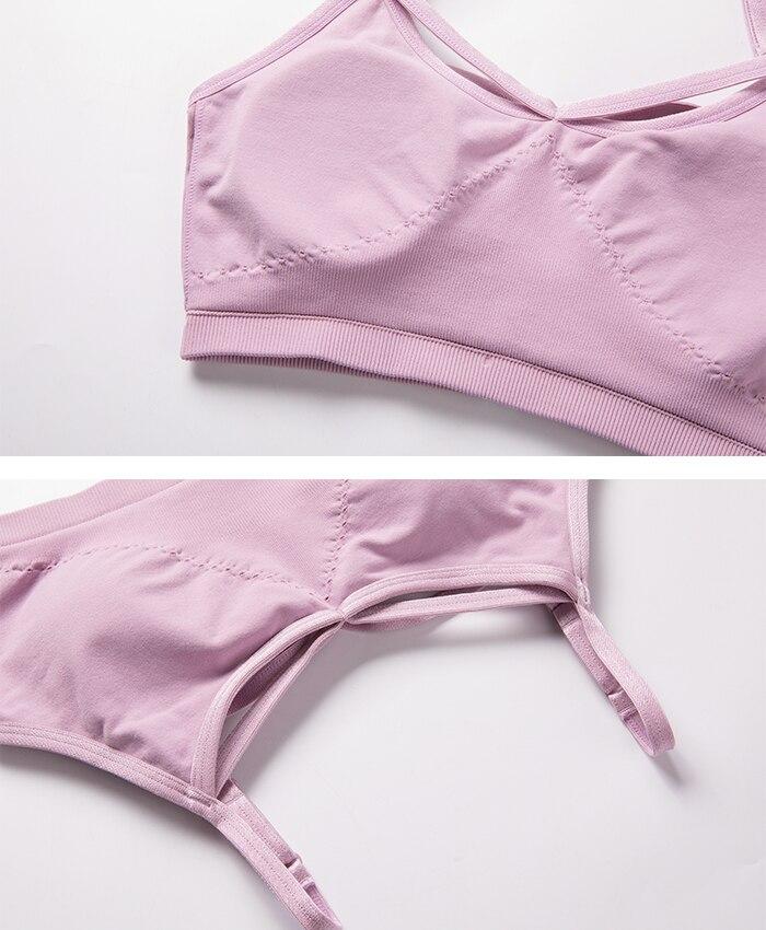 Women's seamless yoga bra top with removable pads and cross strappy back design in black, white, and gray purple colors.