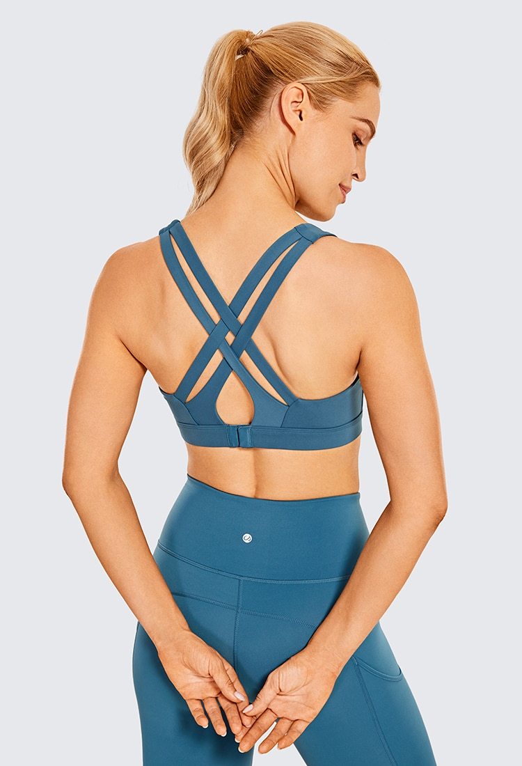 Women's Sexy Stappy Sports Bra featuring a stylish strappy back design, wireless padded support, and anti-sweat material, available in various sizes.