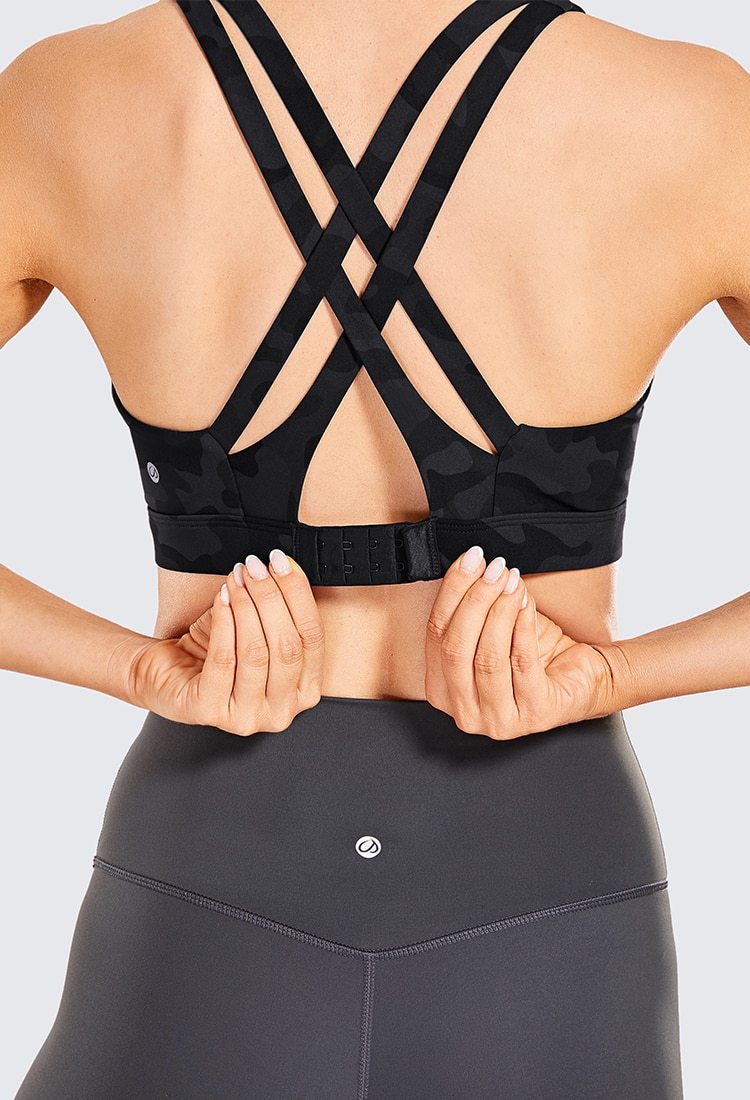 Women's Sexy Stappy Sports Bra featuring a stylish strappy back design, wireless padded support, and anti-sweat material, available in various sizes.