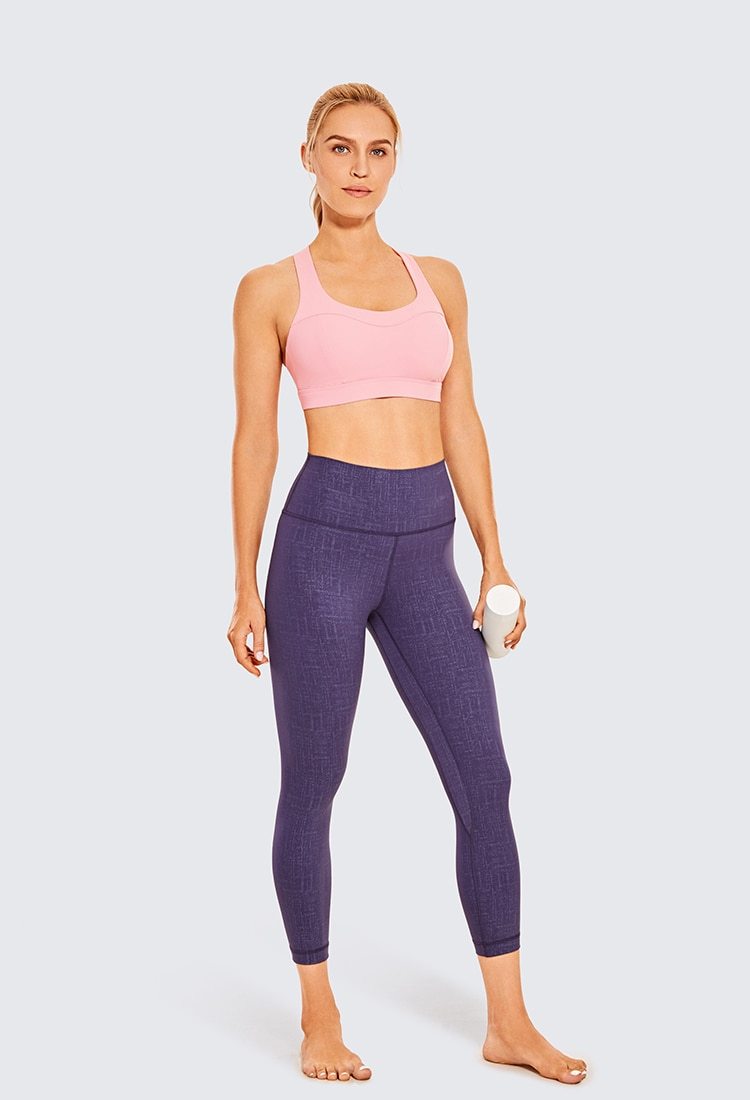 Women's Sexy Stappy Sports Bra featuring a stylish strappy back design, wireless padded support, and anti-sweat material, available in various sizes.