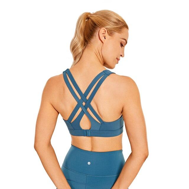 Women's Sexy Stappy Sports Bra featuring a stylish strappy back design, wireless padded support, and anti-sweat material, available in various sizes.