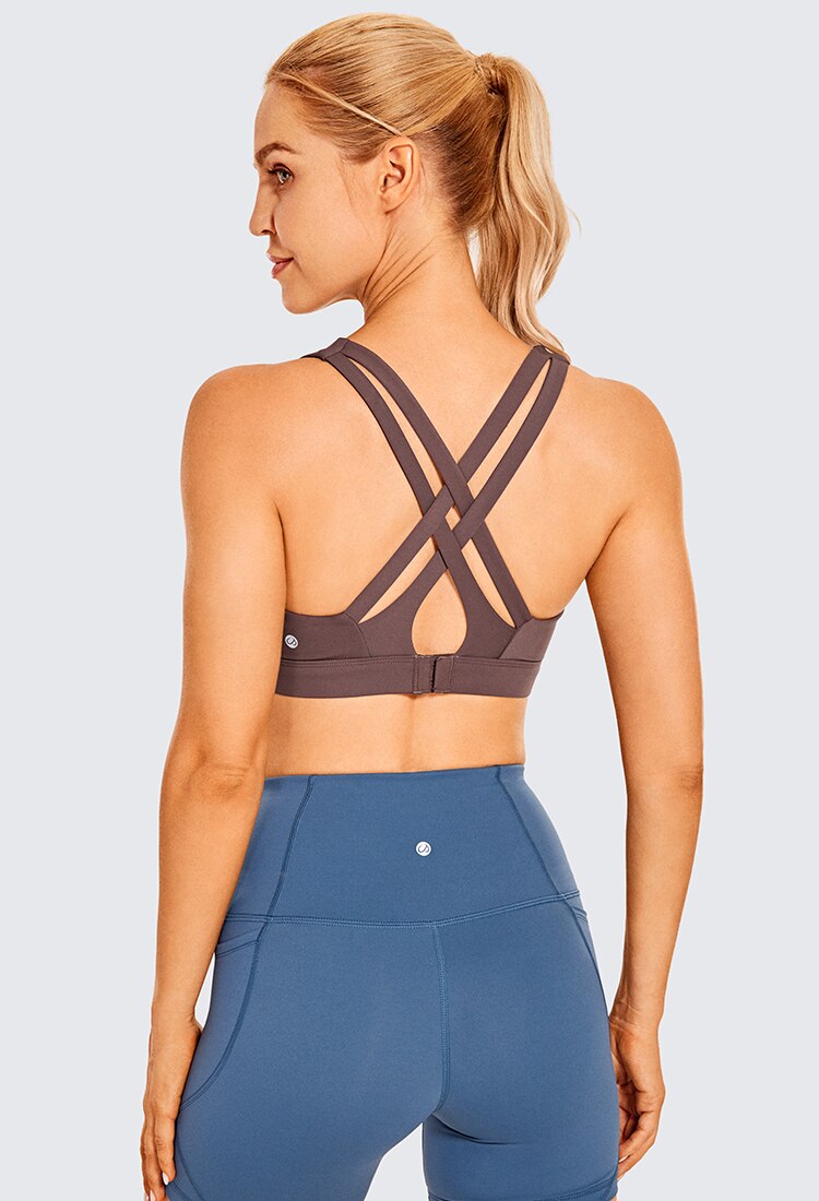 Women's Sexy Stappy Sports Bra featuring a stylish strappy back design, wireless padded support, and anti-sweat material, available in various sizes.