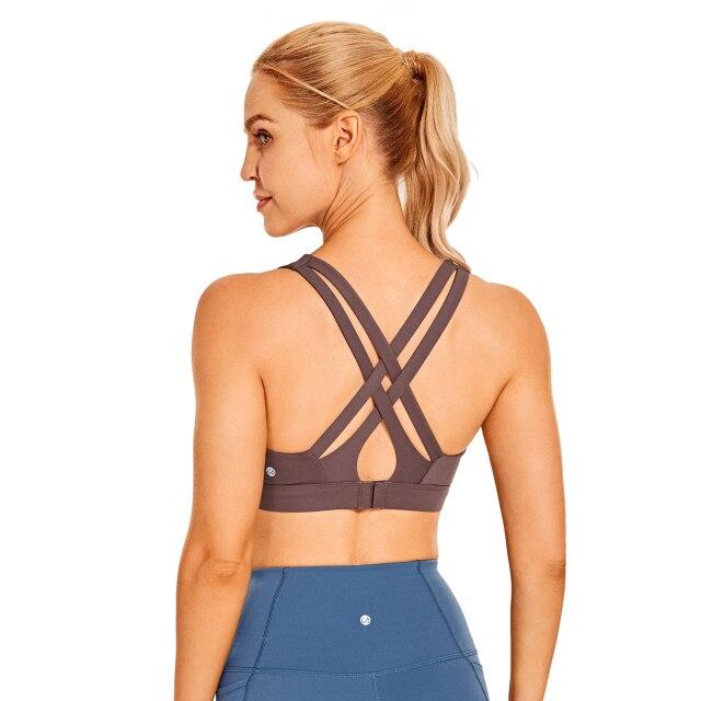Women's Sexy Stappy Sports Bra featuring a stylish strappy back design, wireless padded support, and anti-sweat material, available in various sizes.