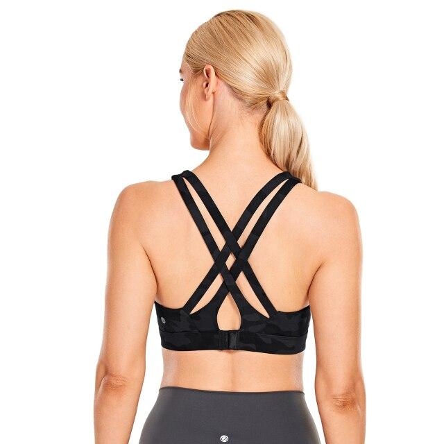 Women's Sexy Stappy Sports Bra featuring a stylish strappy back design, wireless padded support, and anti-sweat material, available in various sizes.