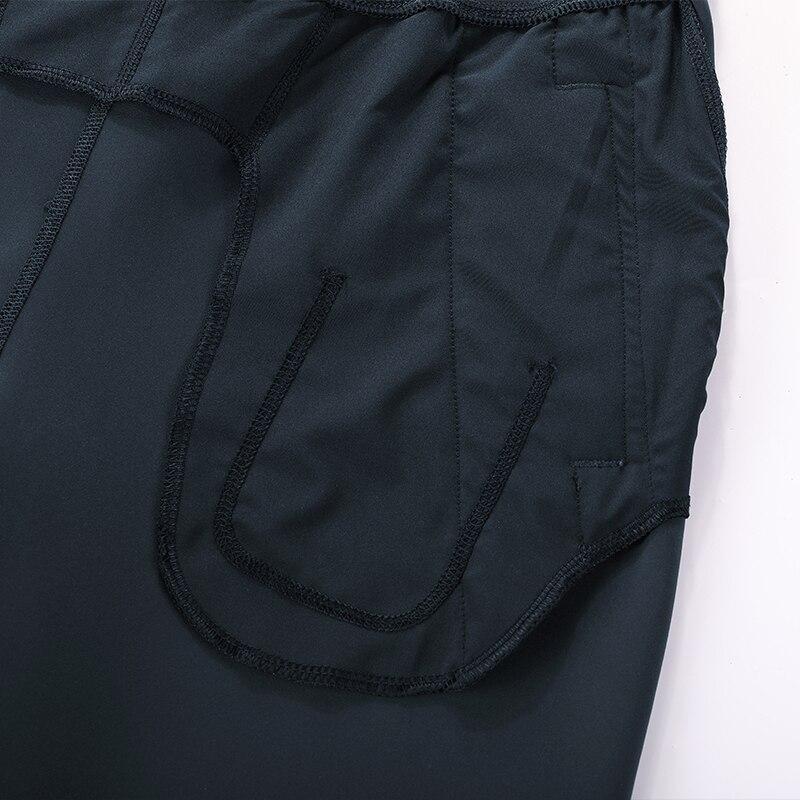 A pair of women's stretch casual jogger pants in black with a drawstring waist and zipper pockets, perfect for travel and lounging.