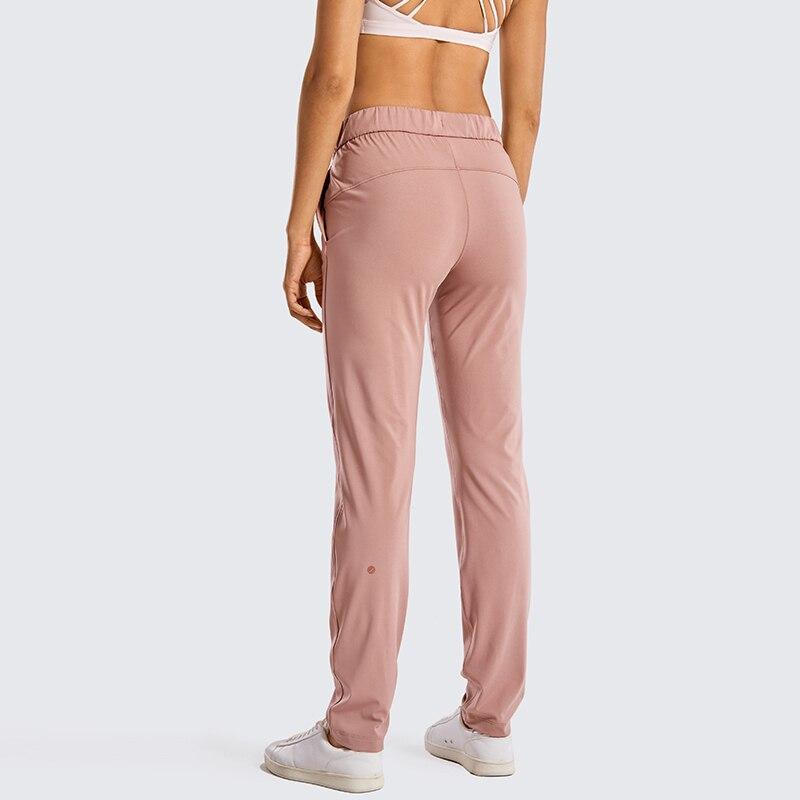A pair of women's stretch lounge sweatpants in a stylish design, featuring a drawstring closure and pockets, perfect for travel and athletic training.