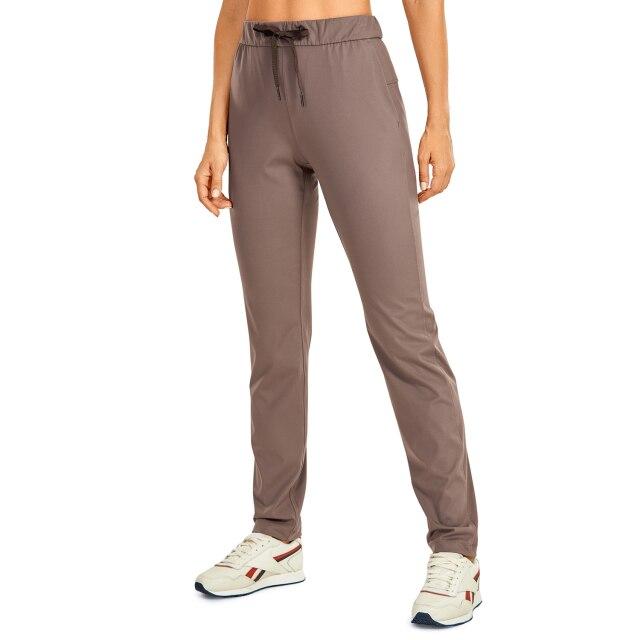 A pair of women's stretch lounge sweatpants in a stylish design, featuring a drawstring closure and pockets, perfect for travel and athletic training.