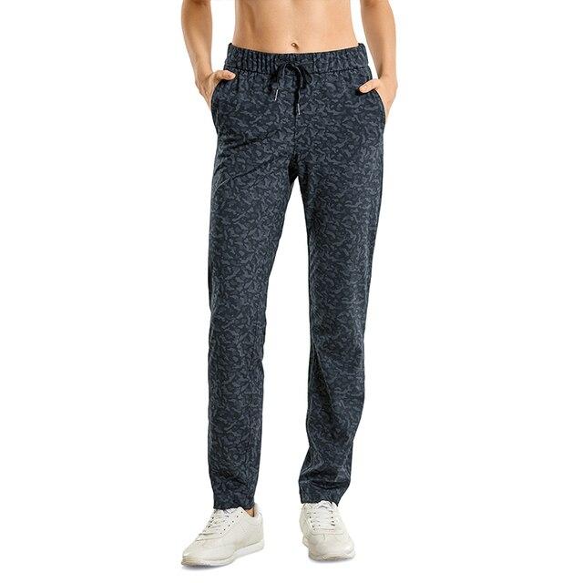 A pair of women's stretch lounge sweatpants in a stylish design, featuring a drawstring closure and pockets, perfect for travel and athletic training.