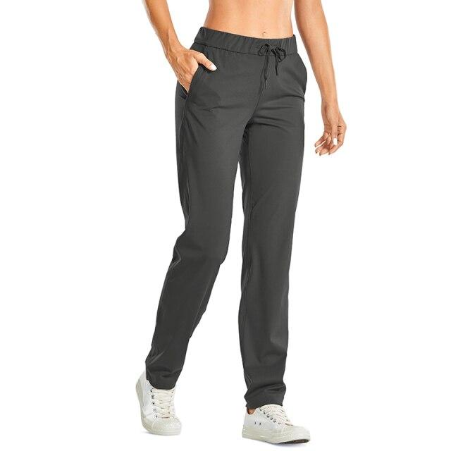 A pair of women's stretch lounge sweatpants in a stylish design, featuring a drawstring closure and pockets, perfect for travel and athletic training.