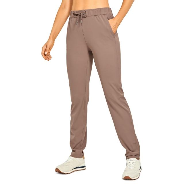 A pair of women's stretch lounge sweatpants in a stylish design, featuring a drawstring closure and pockets, perfect for travel and athletic training.