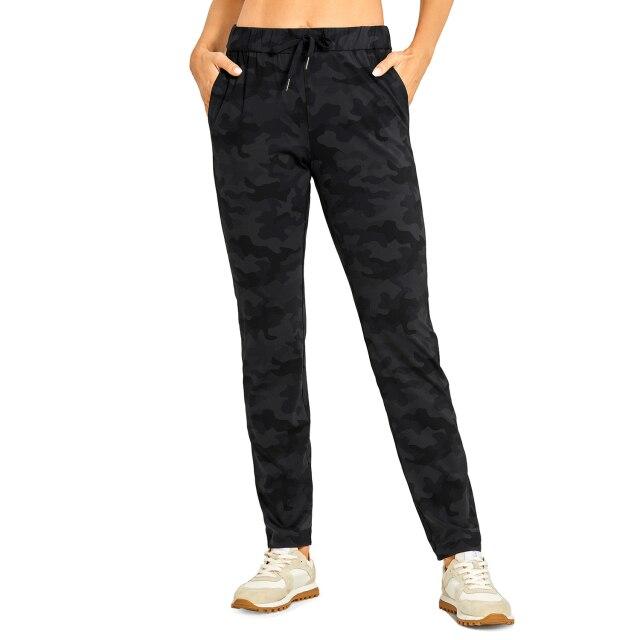 A pair of women's stretch lounge sweatpants in a stylish design, featuring a drawstring closure and pockets, perfect for travel and athletic training.